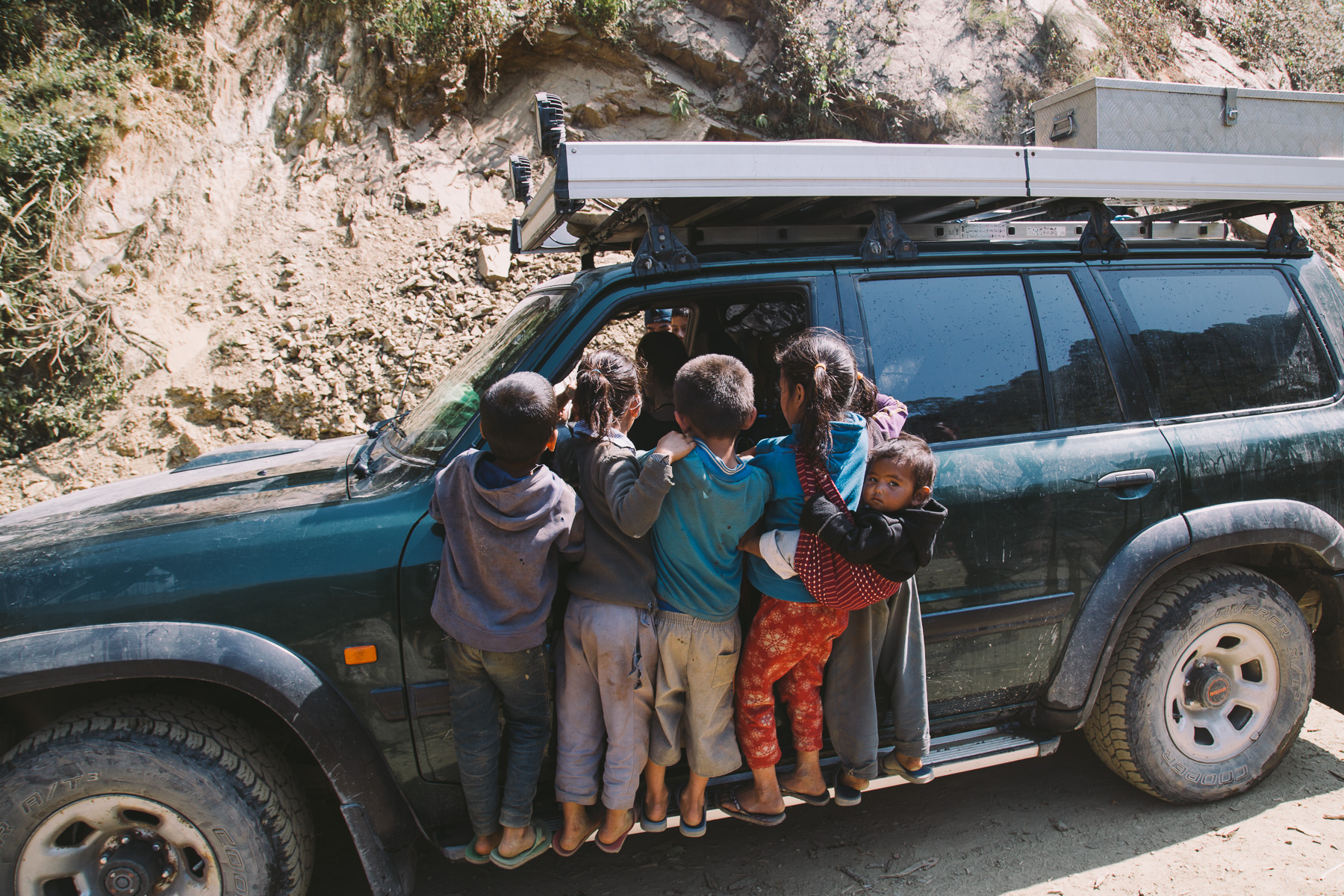 Kids_haning_on_car_West_Nepal_2017-1046